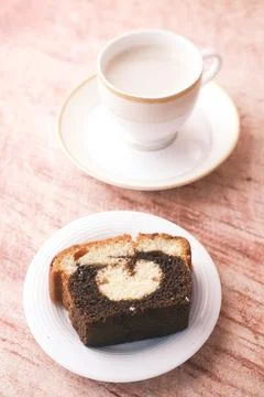 Slice of bakery chocolate cake and tea on table Stock Photos