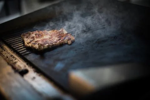 Slice of beef roasted on a barbecue grill Stock Photos