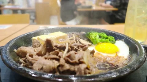 Slice beef tofu egg yoke n broccoli in boil oil in hot pan with smoke Stock Footage 167989117