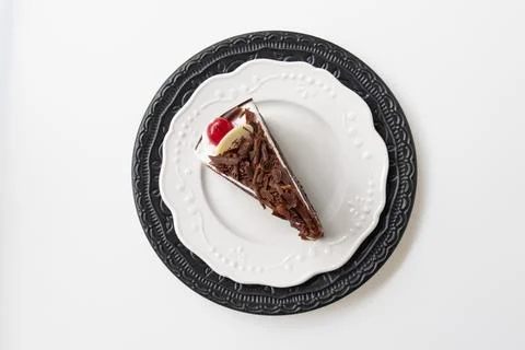 A Slice of Black Forest Cake on Decorative Plates Stock Photos
