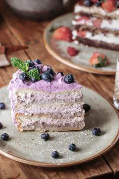 Slice of blueberry cake Stock Photos
