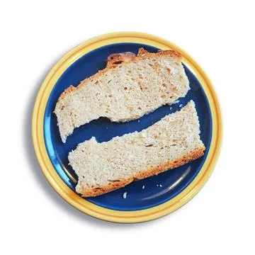 A slice of bread broken in two pieces An image of a slice of bread broken ... Stock Photos