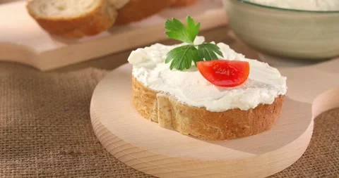 Slice of bread with cream cheese Stock Footage 241221103