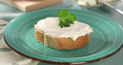 Slice of bread with cream cheese Stock Footage 241221233