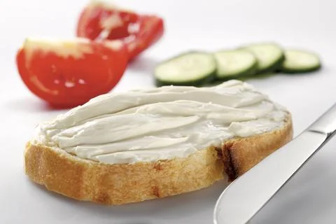 Slice of bread with cream cheese Stock Photos