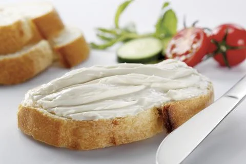 Slice of bread with cream cheese (selective focus) 写真素材