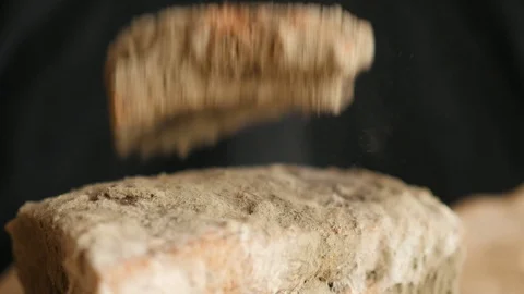 Slice of bread falling on moldy bread, particles of mold slow motion, swirl, flo Stock Footage 115832362