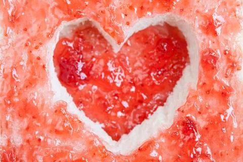 Slice of bread with fruit jam heart shape Stock Photos