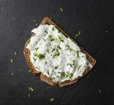 Slice of Bread with Herb Curd (detailed close-up shot) Stock Photos