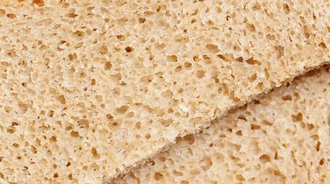 A slice of bread with holes in it 写真素材