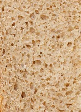 A slice of bread with holes in it Foto stock