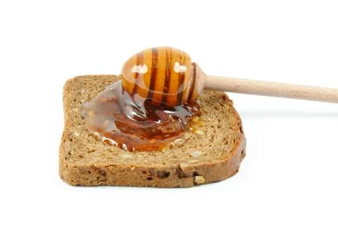 Slice of bread with honey Stock Photos