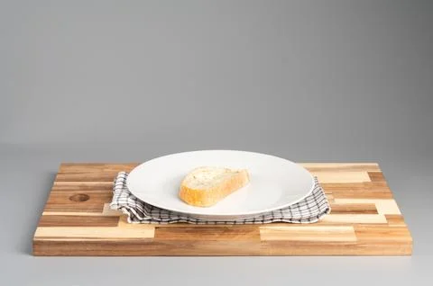 Slice of Bread on Plate with Checkered Napkin Stock Photos
