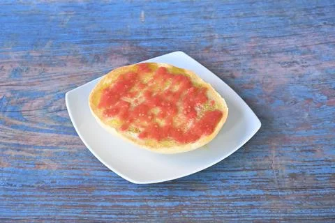 A slice of bread with red sauce on it Stock Photos