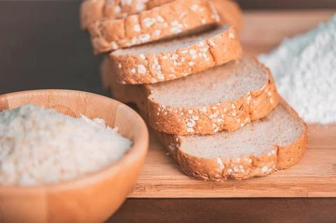 Slice bread rice and flour on wooden cutting board. Nutritious of fiber foo.. Stock Photos