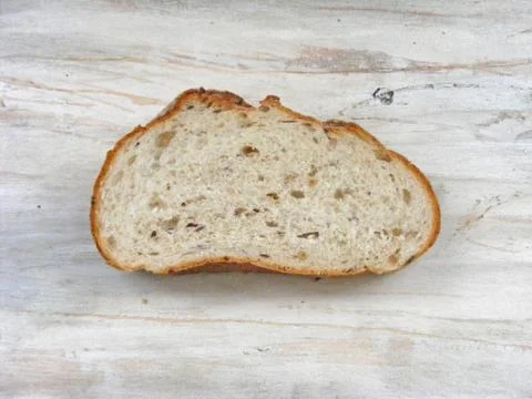 Slice of bread on shabby background flat view Stock Photos