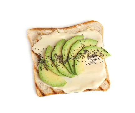 Slice of bread with spread and avocado on white background, top view Stock Photos