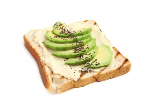 Slice of bread with spread and avocado on white background Stock Photos