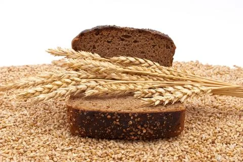 Slice bread with wheat ears Stock Photos