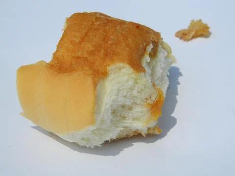 Slice of BREAD ON A WHITE BACKGROUND ISOLATION Stock Photos