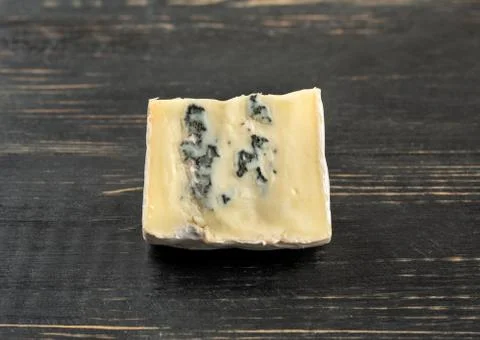 Slice brie cheese Stock Photos