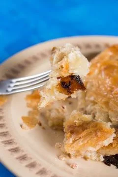 Slice of burek on the fork with blurred background Stock Photos