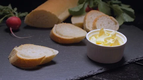 Slice butter slices. Slow motion Stock Footage 105878806