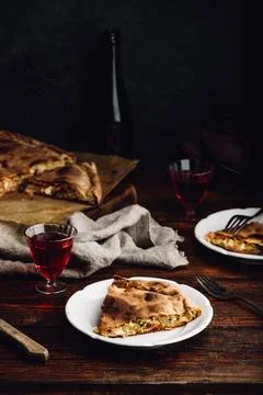 Slice of cabbage pie on white plate Stock Photos