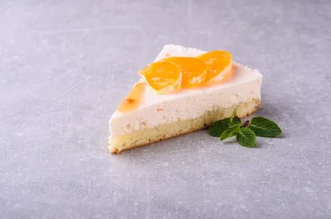 Slice of cake on a gray background for a restaurant Stock Photos