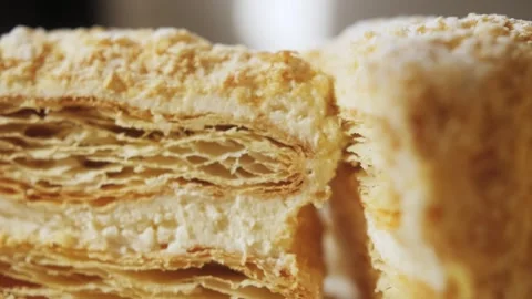 Slice of cake on plate, puff pastry cake with white cream. Stock Footage 255123452