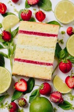 Slice of cake in the section on the background of fruit Stock Photos