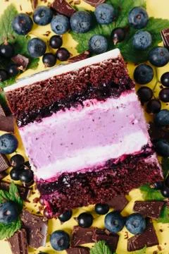 Slice of cake in the section on the background of fruit Stock Photos