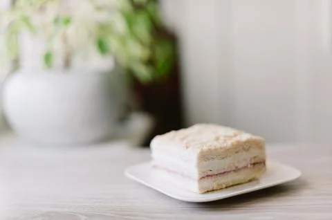 A slice of cake is on a white plate Stock Photos