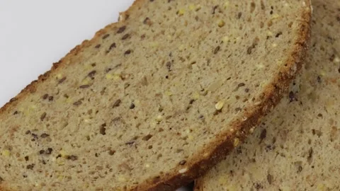 Slice of cereal bread isolated on a white background Stock Footage 259189567