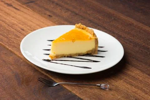 Slice of cheese cake with dark background Stock Photos