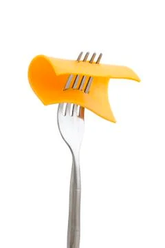 Slice of cheese in fork Stock Photos