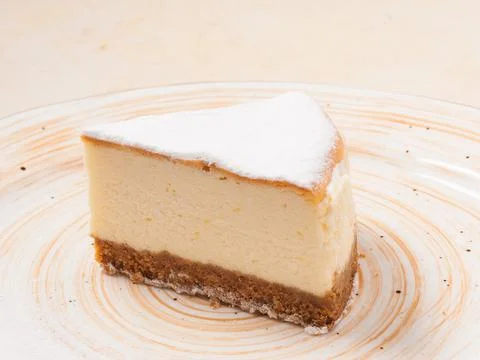 A slice of cheesecake on a plate. Close up Stock Photos
