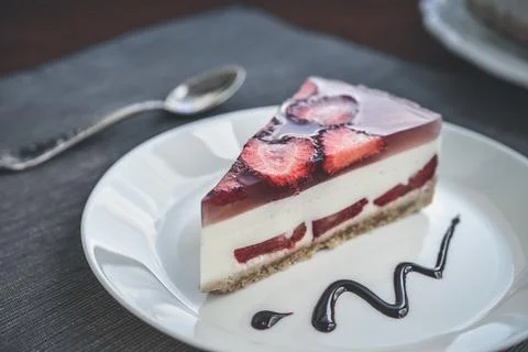 Slice of cheesecake with strawberries Stock Photos