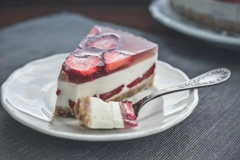 Slice of cheesecake with strawberries Stock Photos