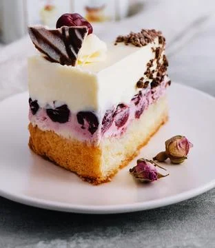 Slice of cherry cheesecake on plate Stock Photos