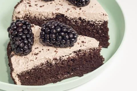 A slice of chocolate cake with forest berries Foto stock