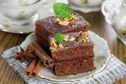 Slice of chocolate cake with nuts Stock Photos