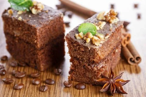 Slice of chocolate cake with nuts Stock Photos