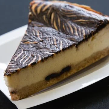 Slice of chocolate cheese cake on a plate Stock Photos