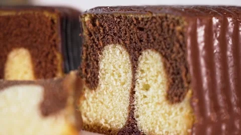 Slice of chocolate marble cake, Selective focus, Close-up Video stock 251120272
