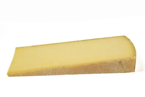 Slice of Comté cheese isolated on a white background Stock Photos