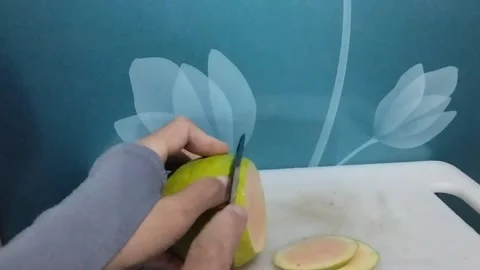 Slice the crystal guava fruit into round shapes Stock Footage 229255023