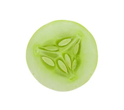 Slice of cucumber isolated on white Fotos de archivo