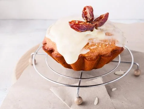 Slice of date cake and dates Stock Photos