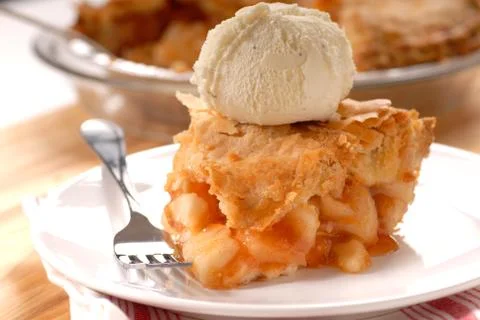 Slice of deep dish apple pie with vanilla ice cream Stock Photos